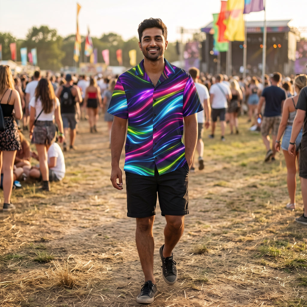 Man wearing the Neon Flow shirt with black shorts at a daytime summer music festival