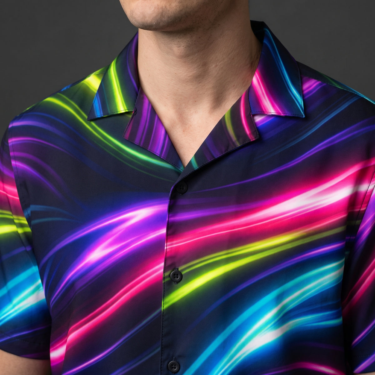 Close-up of the Neon Flow shirt open camp collar and dark front buttons