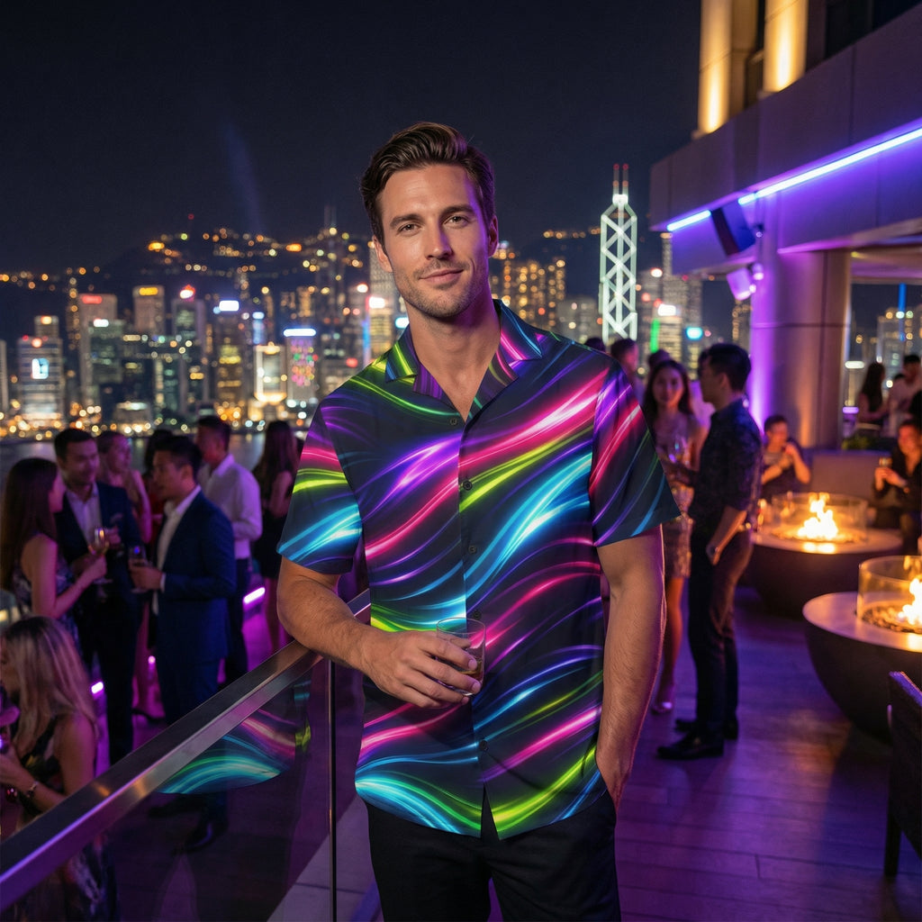Man wearing the Neon Flow shirt at a rooftop party at night with a city skyline