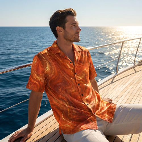 Man wearing the Burnt Copper Flow burnt orange marble button-up shirt on a yacht deck at sunset