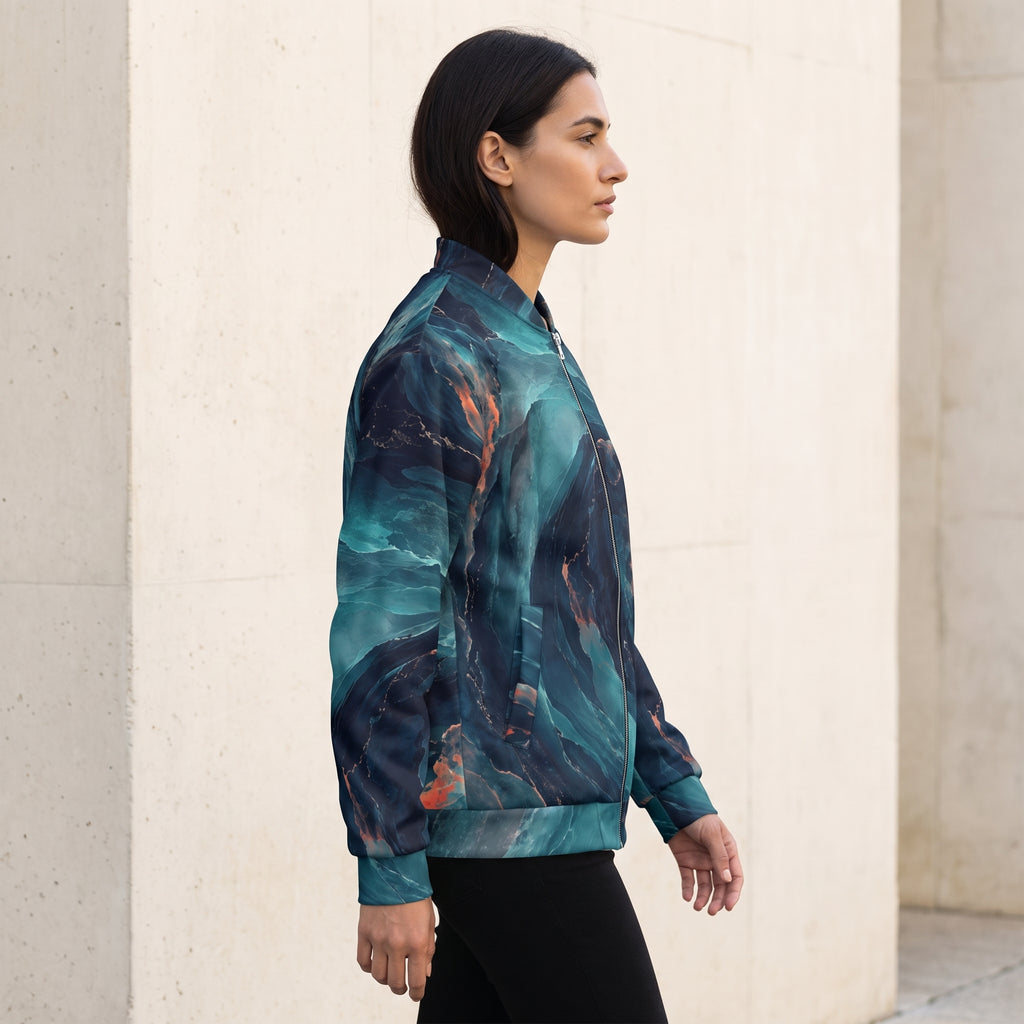 Woman walking in the Neon Nebula bomber jacket – navy, turquoise and coral nebula print