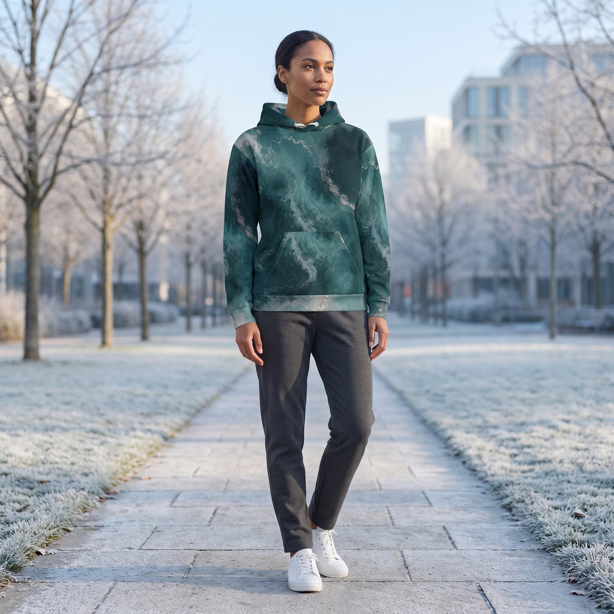 Woman wearing the Abyssal Current teal and turquoise marble hoodie