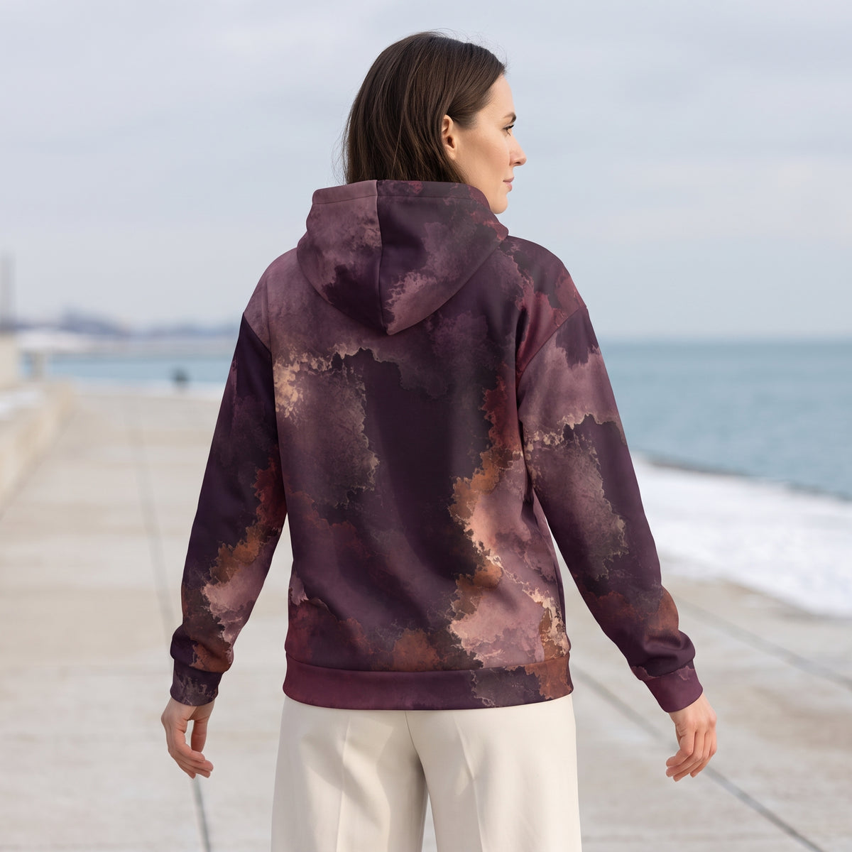 Woman wearing the Ember Eclipse all-over print hoodie