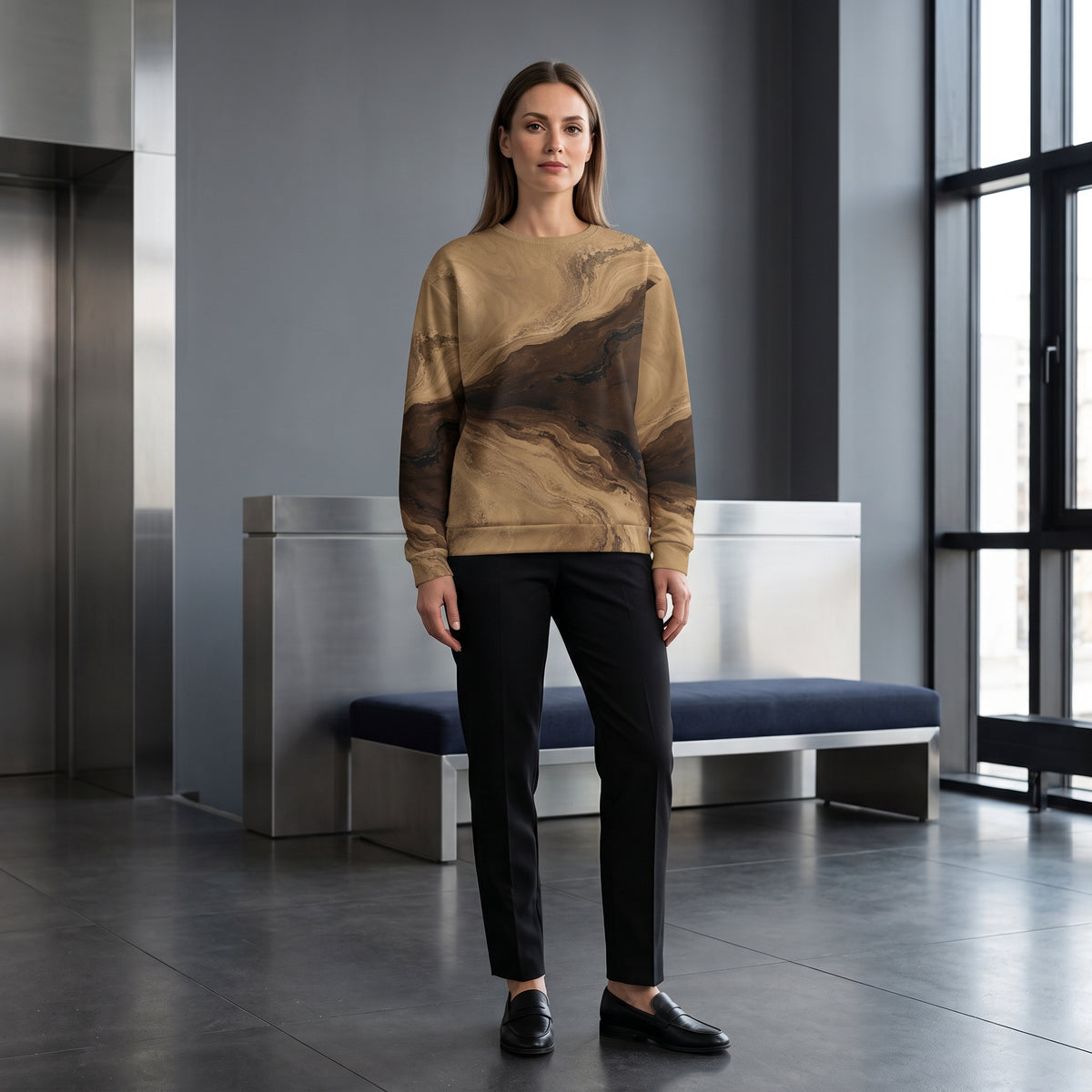 Woman wearing the Terra Strata sweatshirt – beige, chocolate brown and charcoal marble print