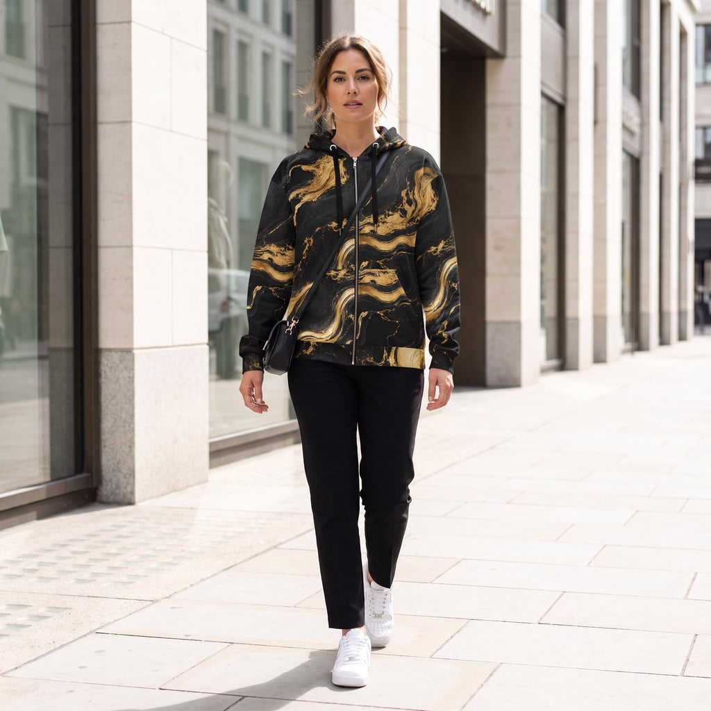 Woman wearing the Golden Oro zip hoodie – black and gold marble print