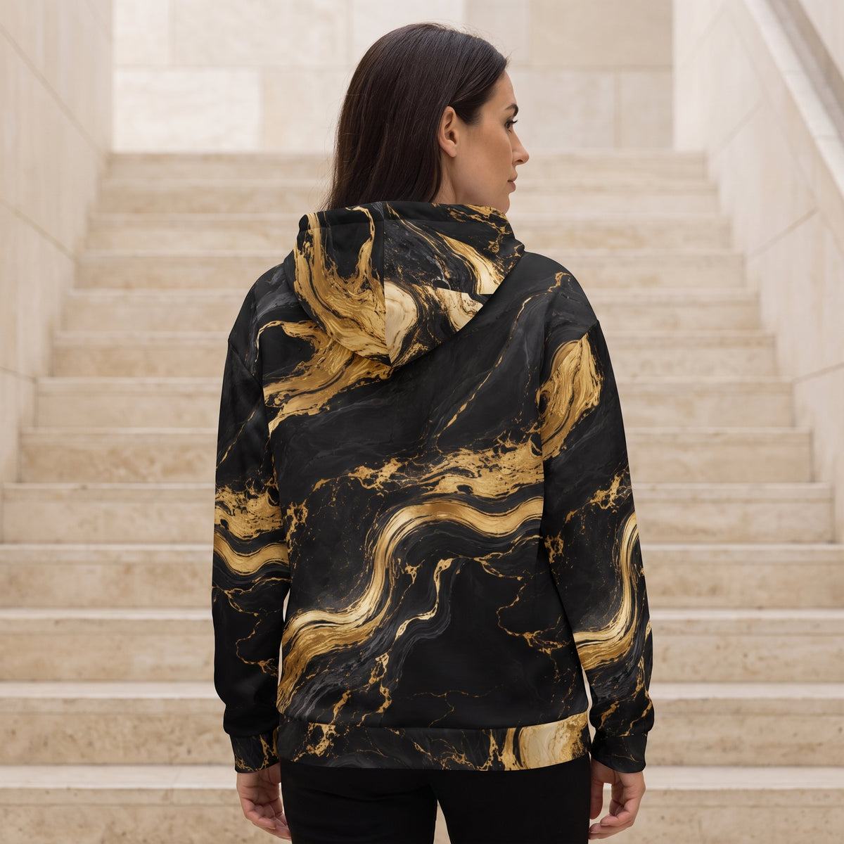 Woman wearing the Golden Oro zip hoodie – black and gold marble print