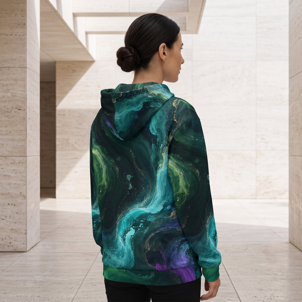 Woman wearing the Emerald Tides zip hoodie, emerald and turquoise print