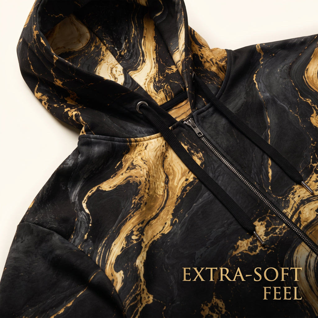 Close-up of the Golden Oro zip hoodie black and gold print and fabric