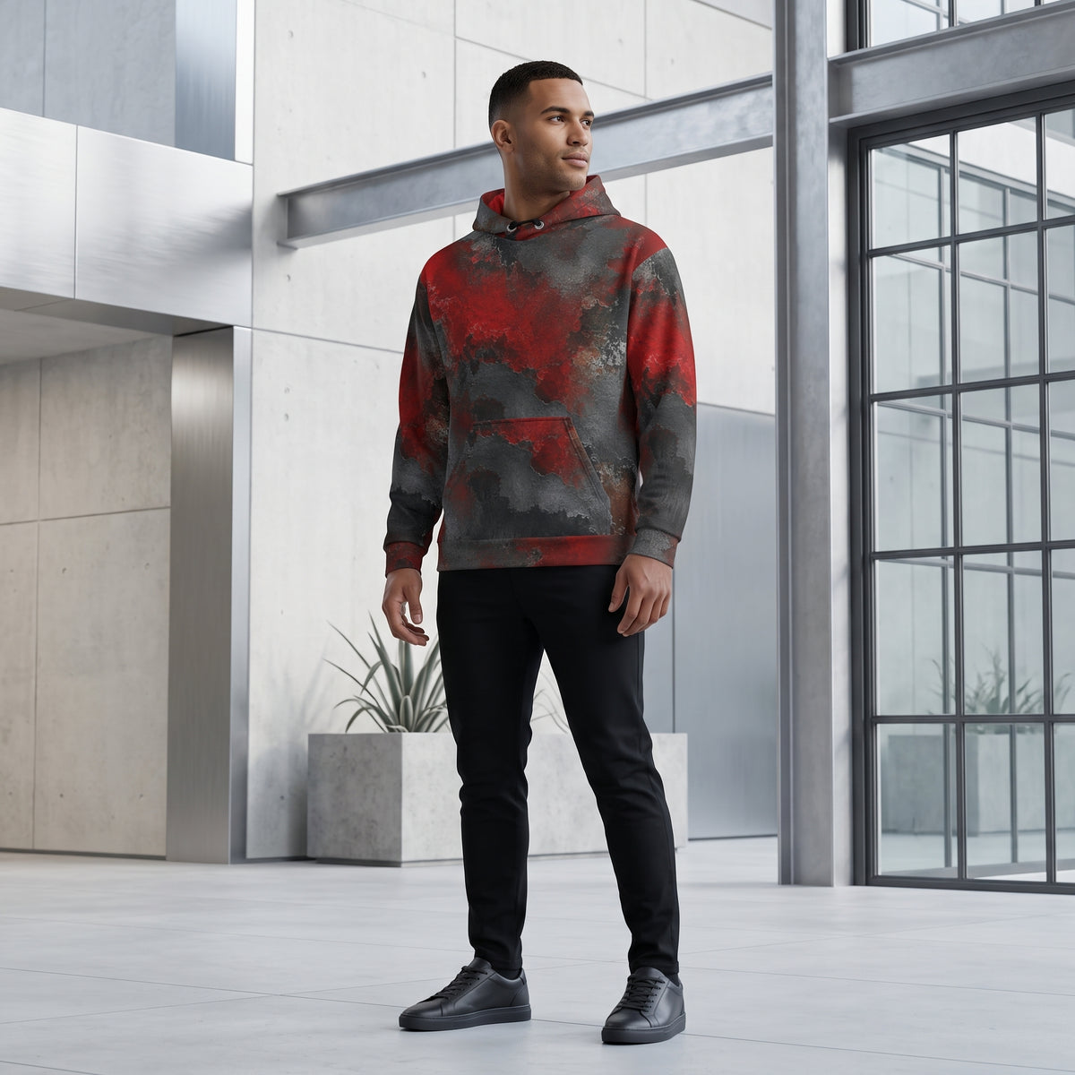 Man wearing the Red & Black Abstract hoodie, red and black print