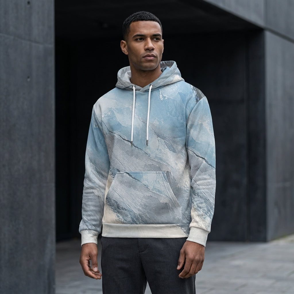 Man wearing the Glacial Current hoodie – icy blue, white and slate grey marble print