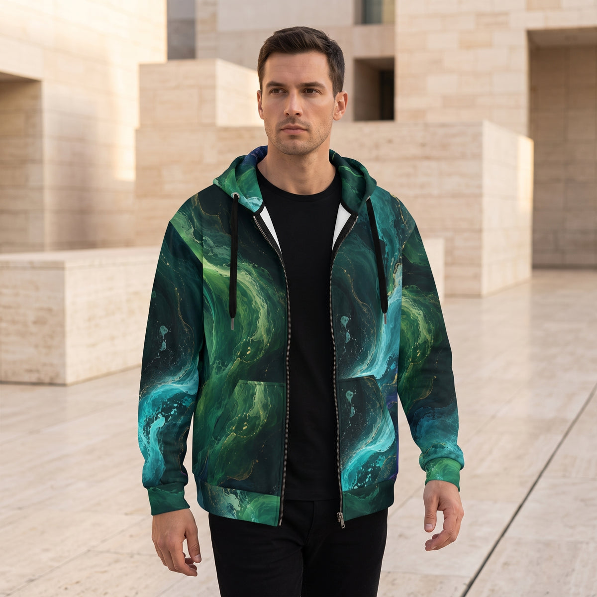 Man wearing the Emerald Tides zip hoodie – emerald, turquoise and midnight blue abstract print