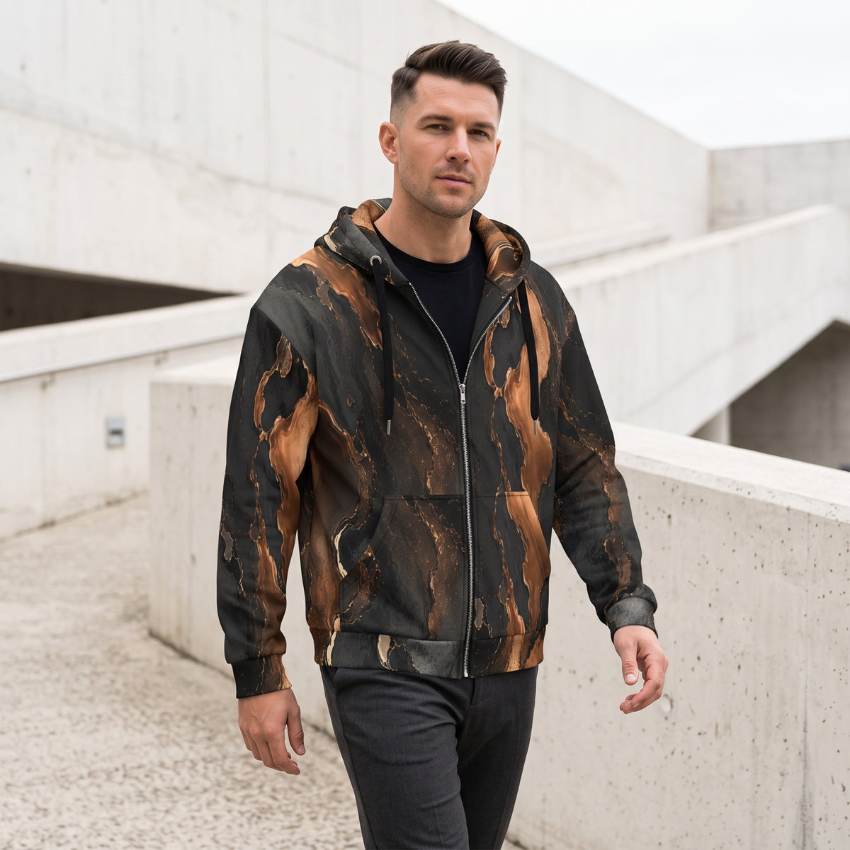 Man wearing the Molten Ember zip hoodie, black and copper print