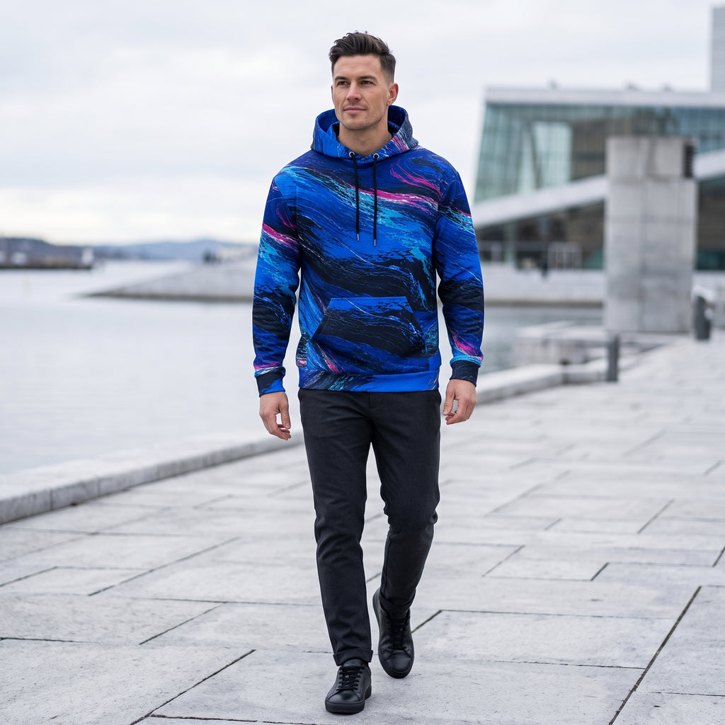 Man walking in the Cobalt Afterglow hoodie – cobalt blue, turquoise and magenta wave print
