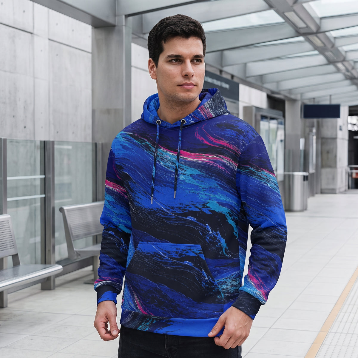 Man wearing the Cobalt Afterglow hoodie by modern architecture – cobalt blue, turquoise and magenta wave print