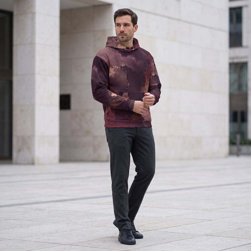 Man wearing the Ember Eclipse hoodie in an urban plaza, burgundy and plum print