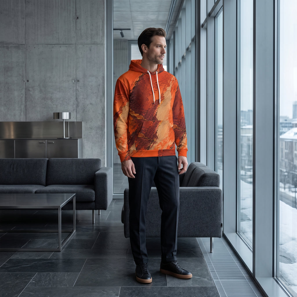 Man wearing the Ember Terrain hoodie, burnt orange and brown print
