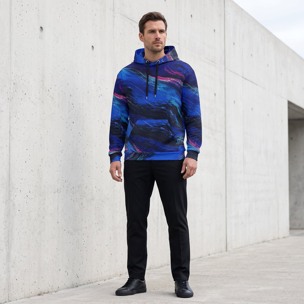 Man wearing the Cobalt Afterglow hoodie – cobalt blue, turquoise and magenta wave print