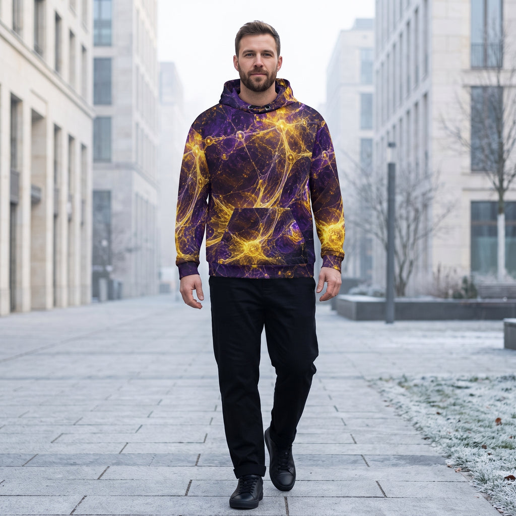 A man walking down a city street wearing a purple and yellow cosmic nebula print hoodie, black pants, and black shoes.