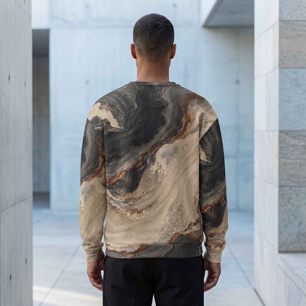 A man viewed from behind wearing a long-sleeve crewneck sweatshirt with a realistic black, gray, and beige marble pattern, standing in a modern concrete corridor.