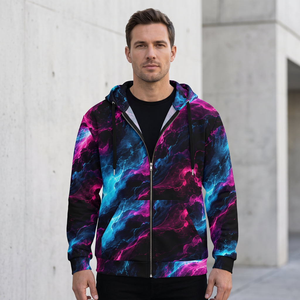 Man wearing the Neon Vortex zip hoodie – cyan, magenta and black nebula print
