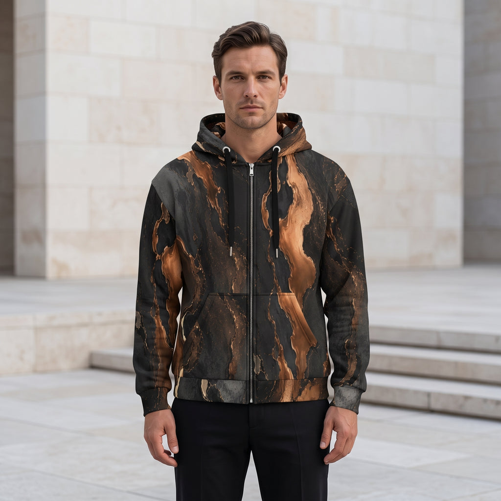 Man wearing the Molten Ember zip hoodie zipped up – black and copper abstract print
