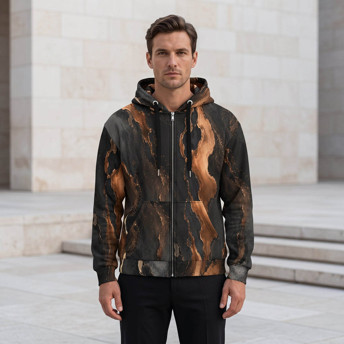 Man wearing the Molten Ember zip hoodie zipped up – black and copper abstract print