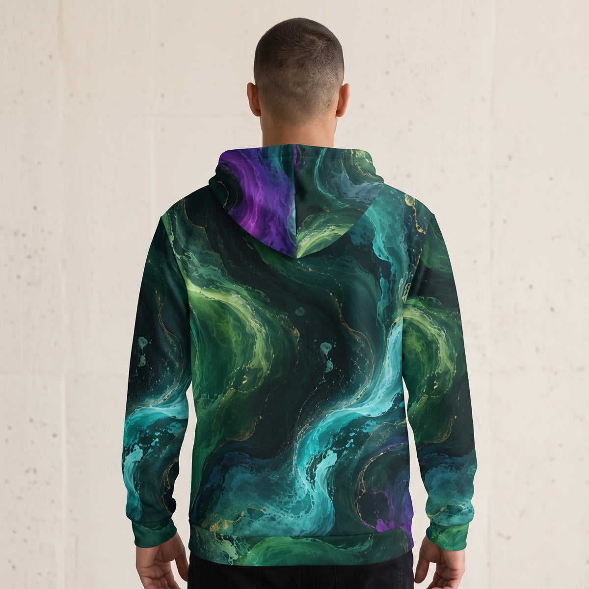 Model wearing the Emerald Tides zip hoodie zipped up, emerald and turquoise print