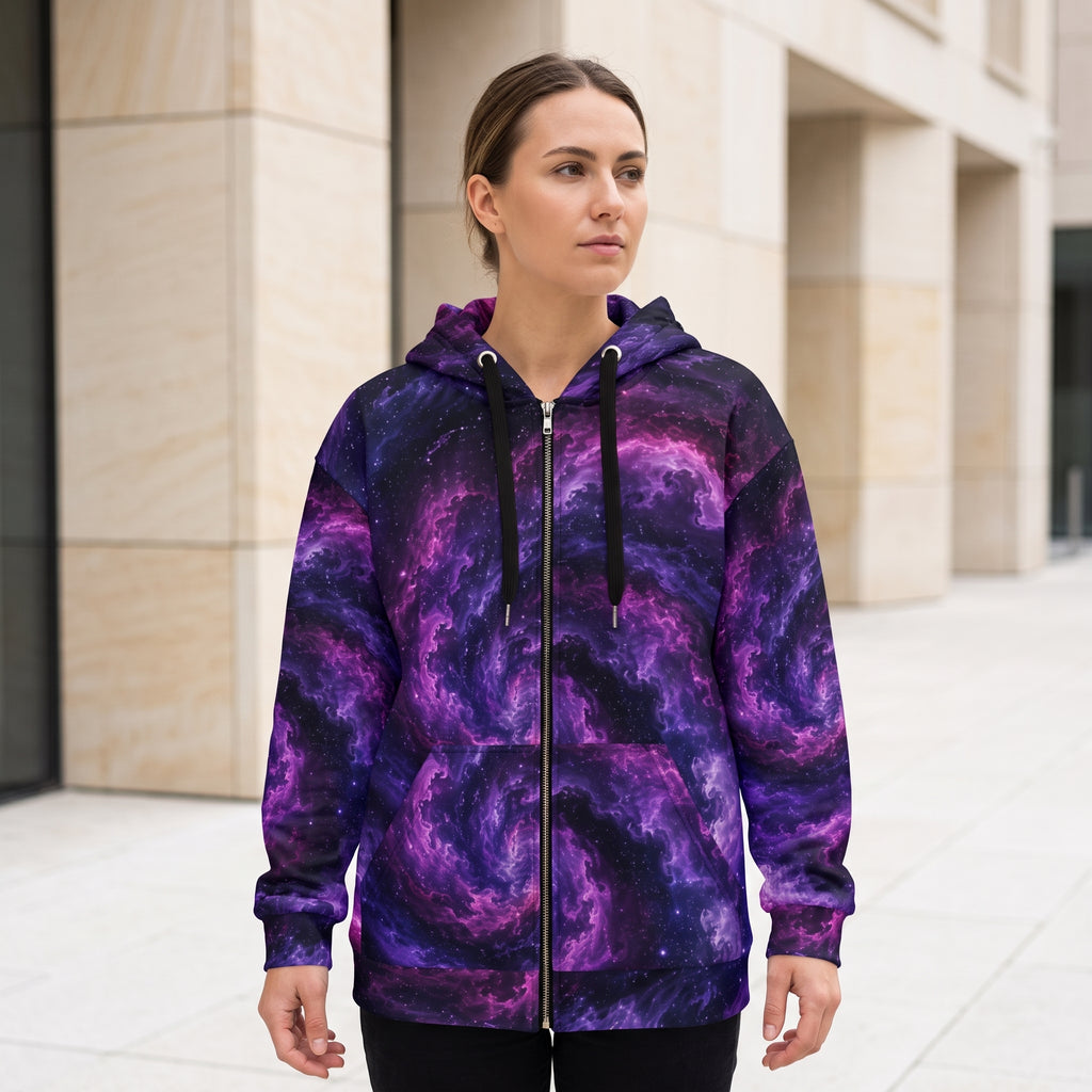 Model wearing the Cosmic Vortex zip hoodie – violet, purple and black nebula print
