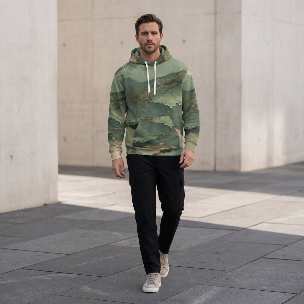 Model walking in the Verdant Terrain hoodie – sage, olive and gold abstract print