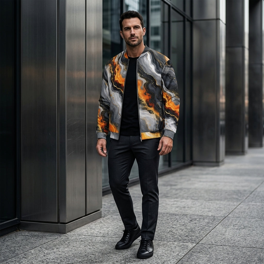 Model wearing the Molten Obsidian bomber jacket – charcoal, silver and fiery orange abstract print