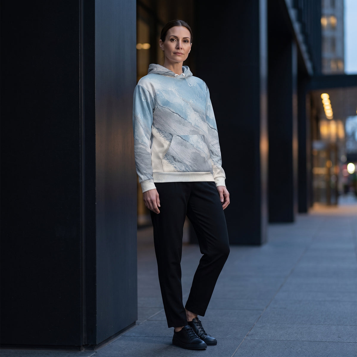 Model wearing the Glacial Current all-over print hoodie