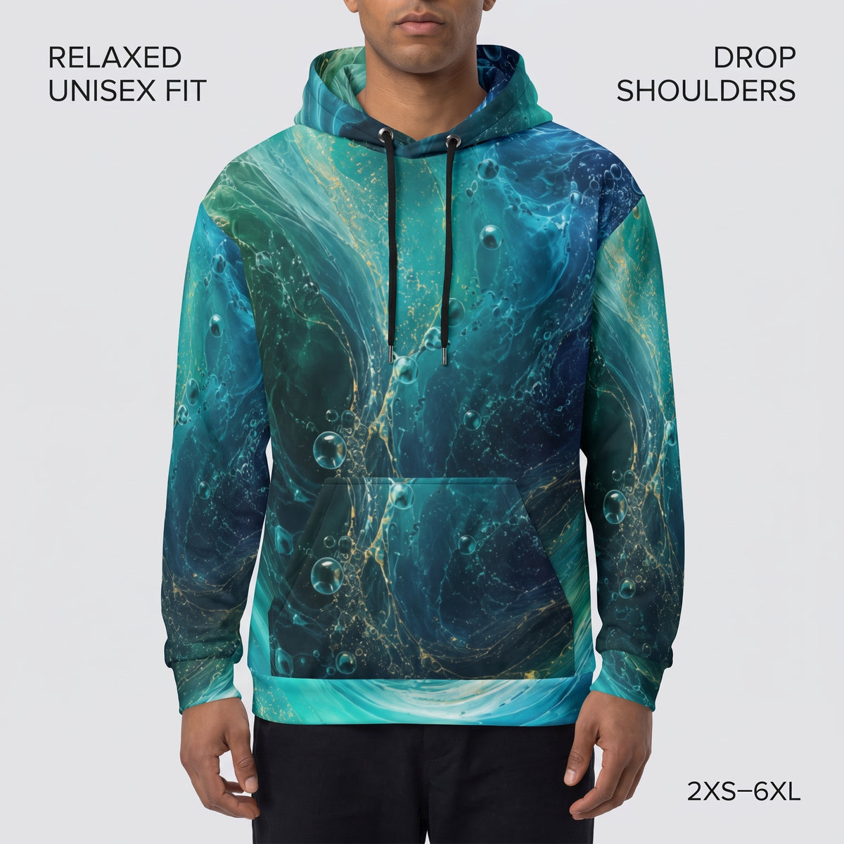 Model wearing the Oceanic Flow hoodie, turquoise and teal print
