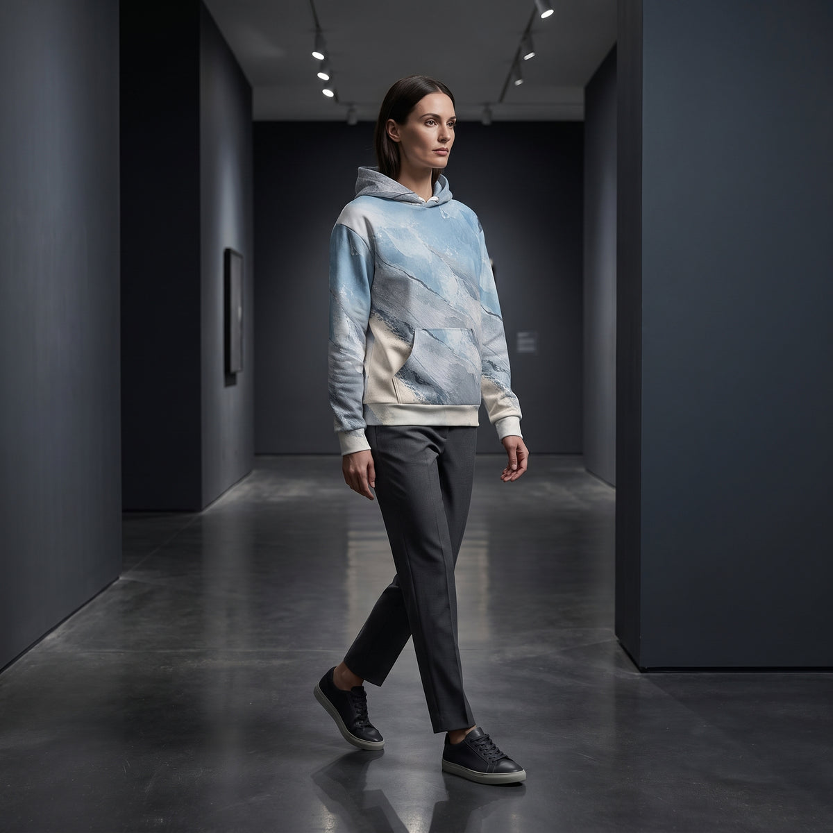 Model wearing the Glacial Current hoodie – icy blue, white and slate grey marble print