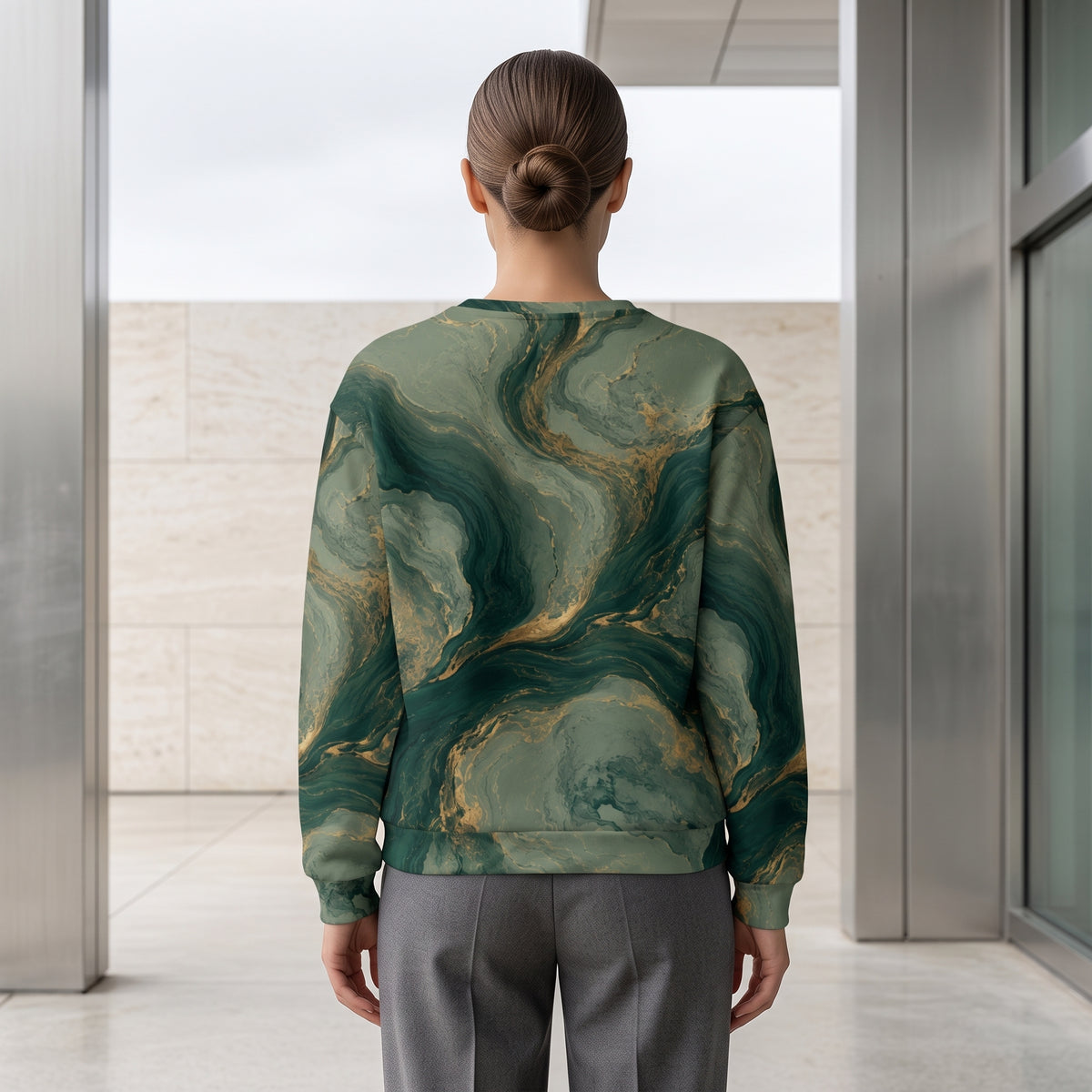 Model wearing the Emerald Current sweatshirt, back view – forest green, sage and gold marble print