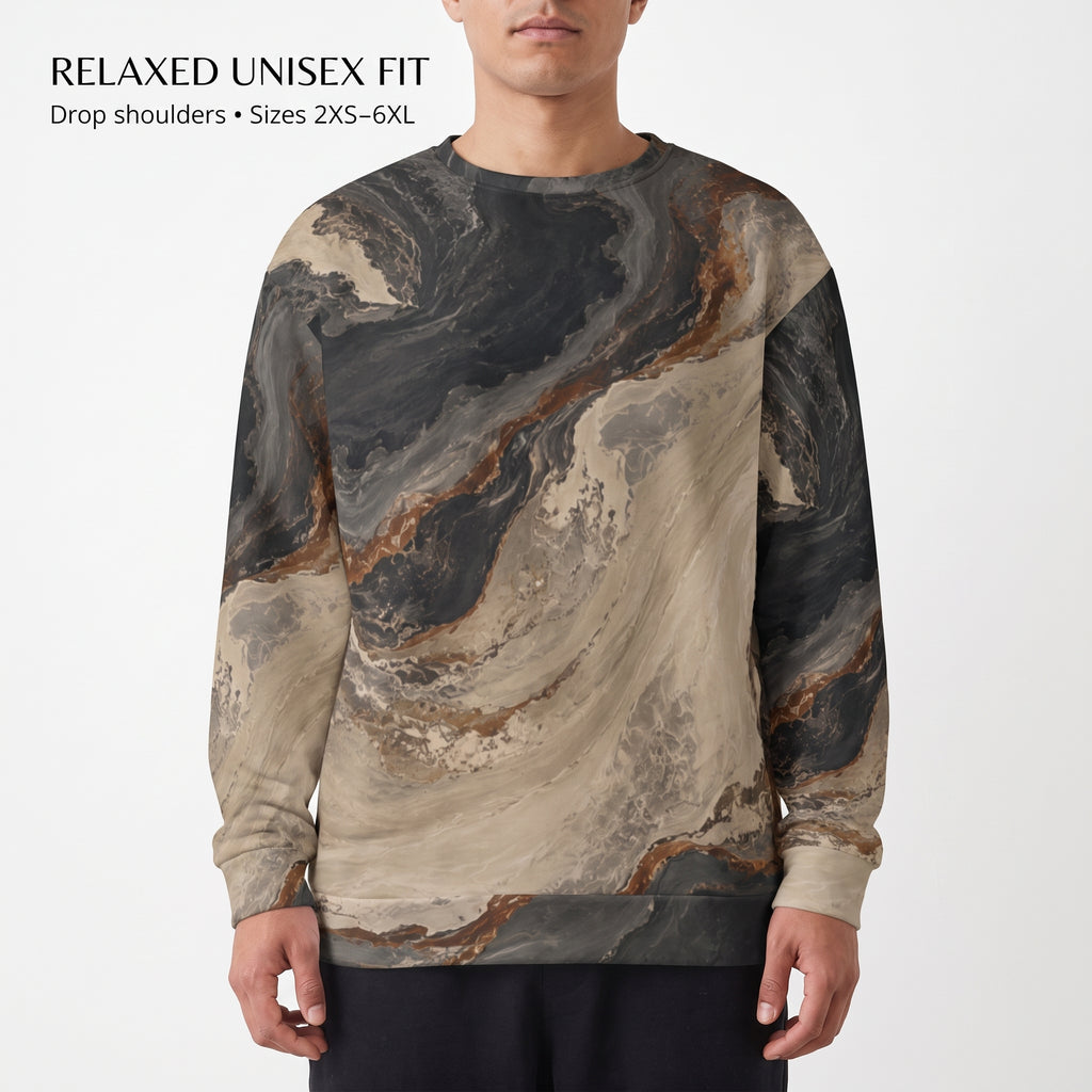 A man wearing a long-sleeve crewneck sweatshirt with a beige, brown, and dark gray marble pattern. The image has a white background with text in the top left corner reading 'RELAXED UNISEX FIT' and 'Drop shoulders • Sizes 2XS-6XL'.