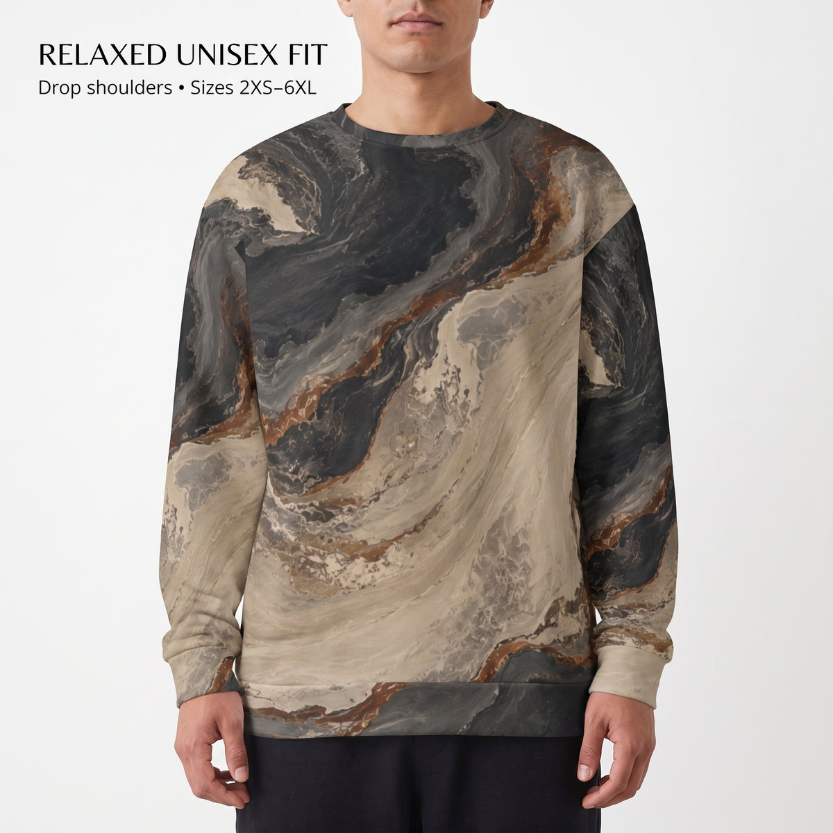A man wearing a long-sleeve crewneck sweatshirt with a beige, brown, and dark gray marble pattern. The image has a white background with text in the top left corner reading 'RELAXED UNISEX FIT' and 'Drop shoulders • Sizes 2XS-6XL'.