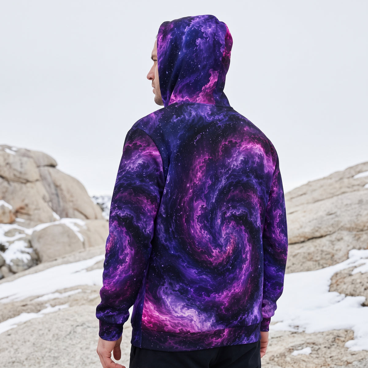 Model wearing the Cosmic Vortex zip hoodie – violet, purple and black nebula print