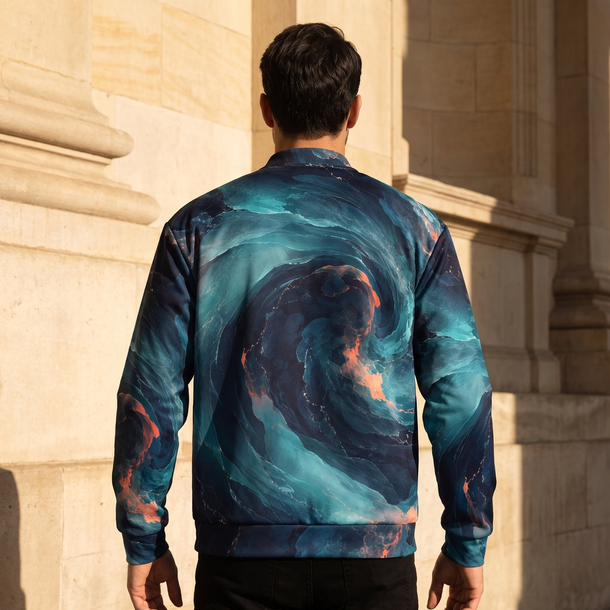 Model wearing the Neon Nebula bomber jacket zipped up – navy, turquoise and coral nebula print