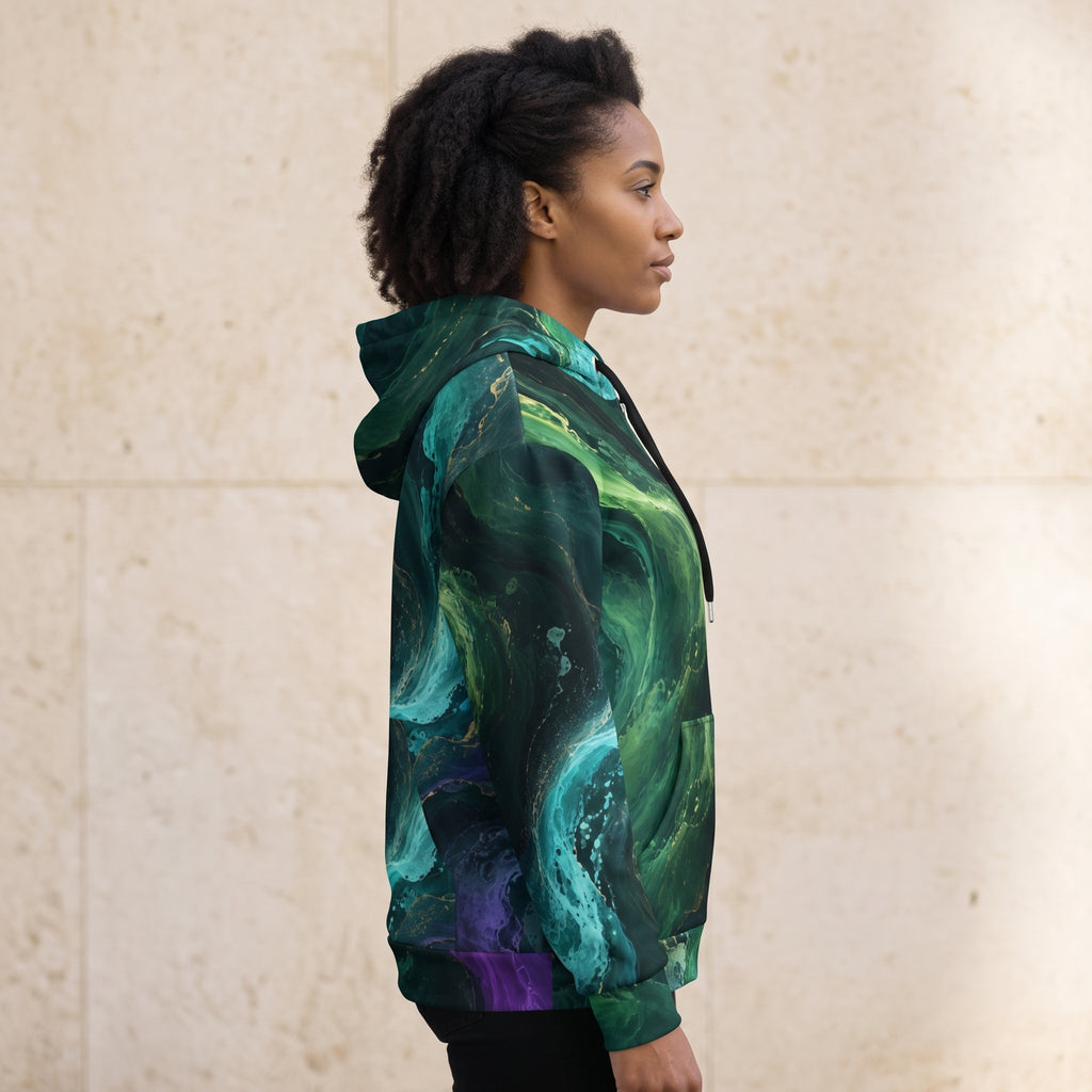 Model wearing the Emerald Tides zip hoodie zipped up, emerald and turquoise print