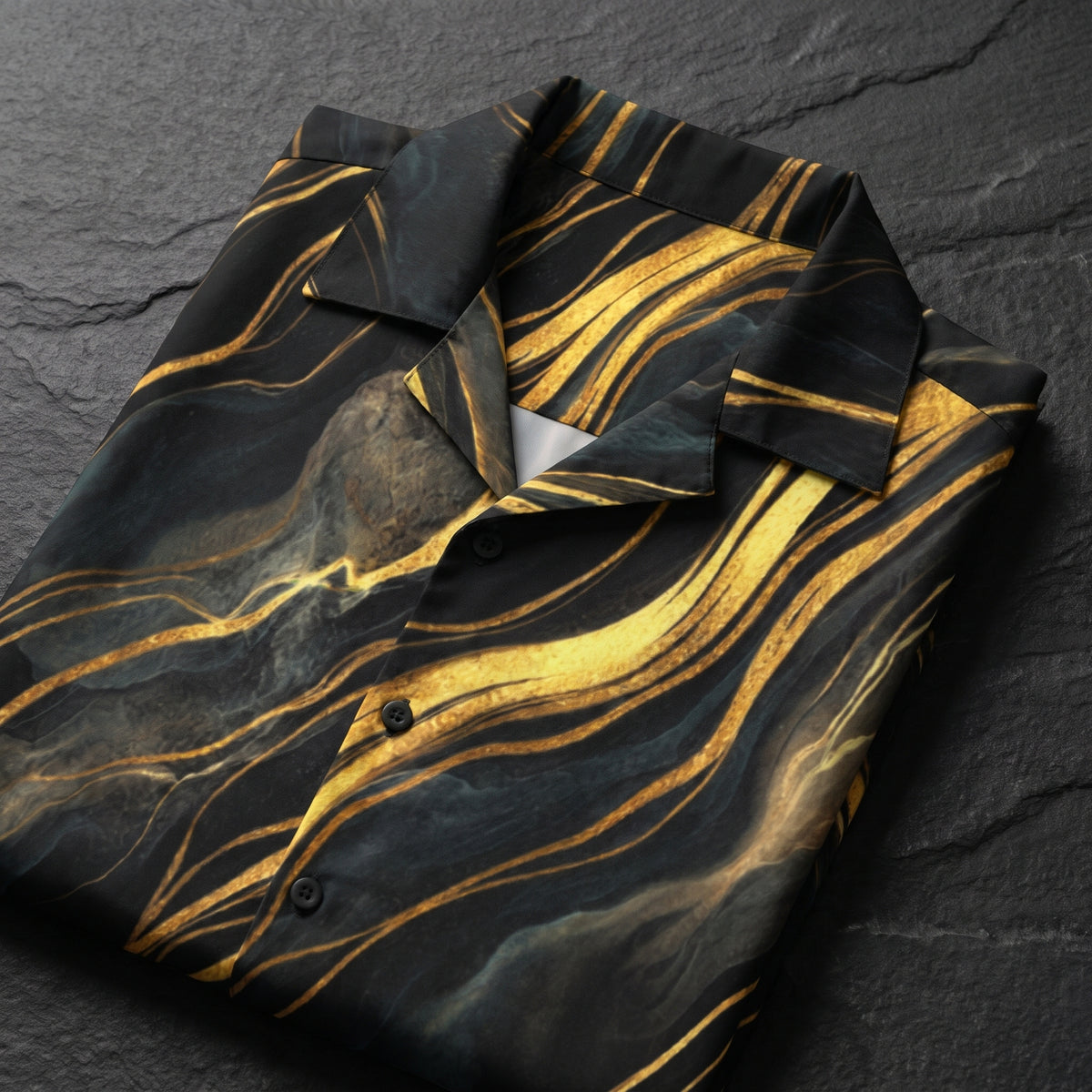 Close-up of the camp collar and buttons on the black and gold shirt