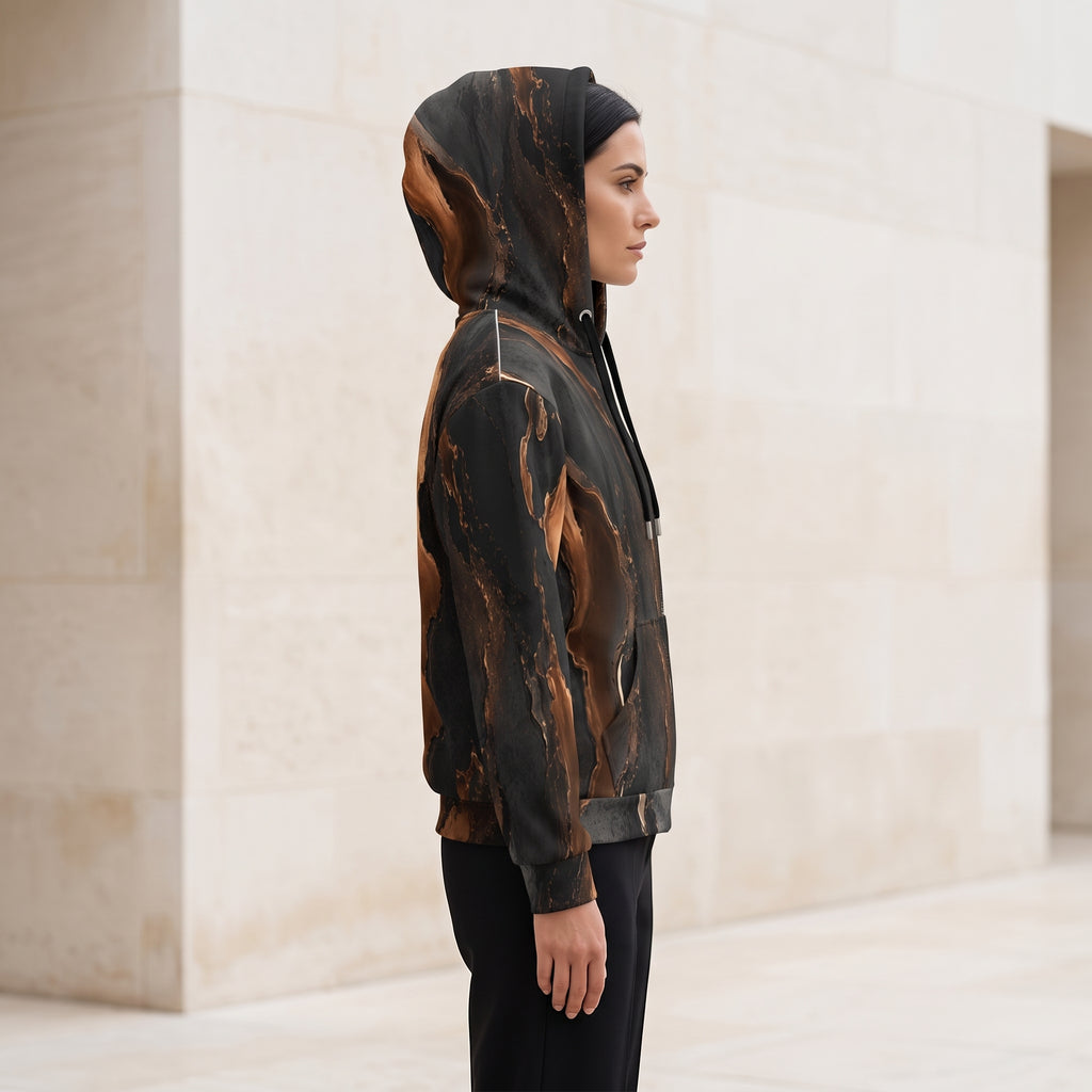 Woman wearing the Molten Ember zip hoodie zipped up, black and copper print