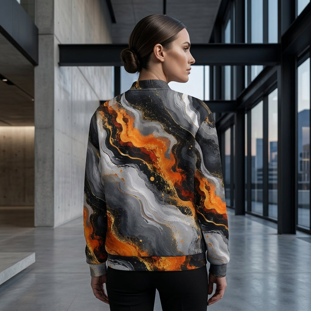 Woman wearing the Molten Obsidian bomber jacket, charcoal and orange print