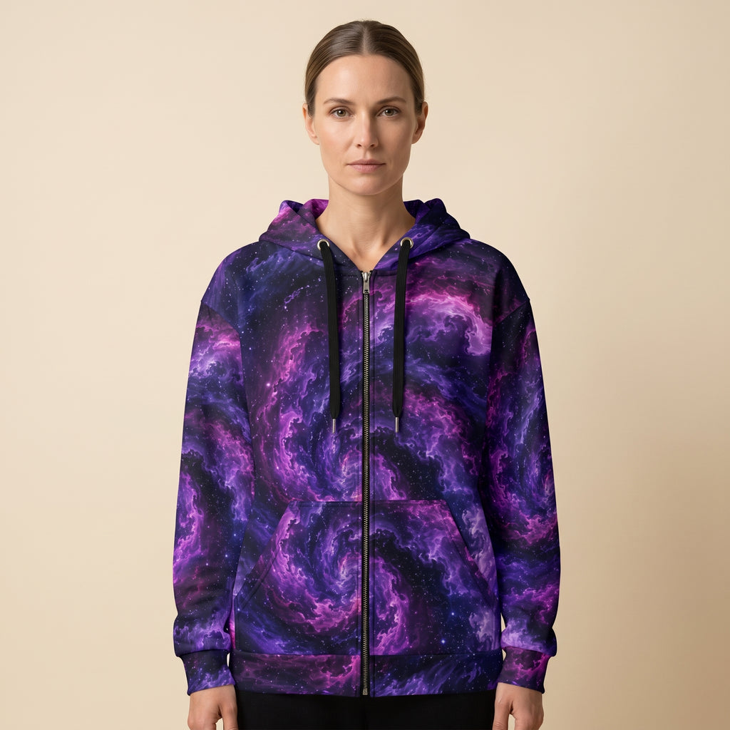 Woman wearing the Cosmic Vortex zip hoodie, violet and black print