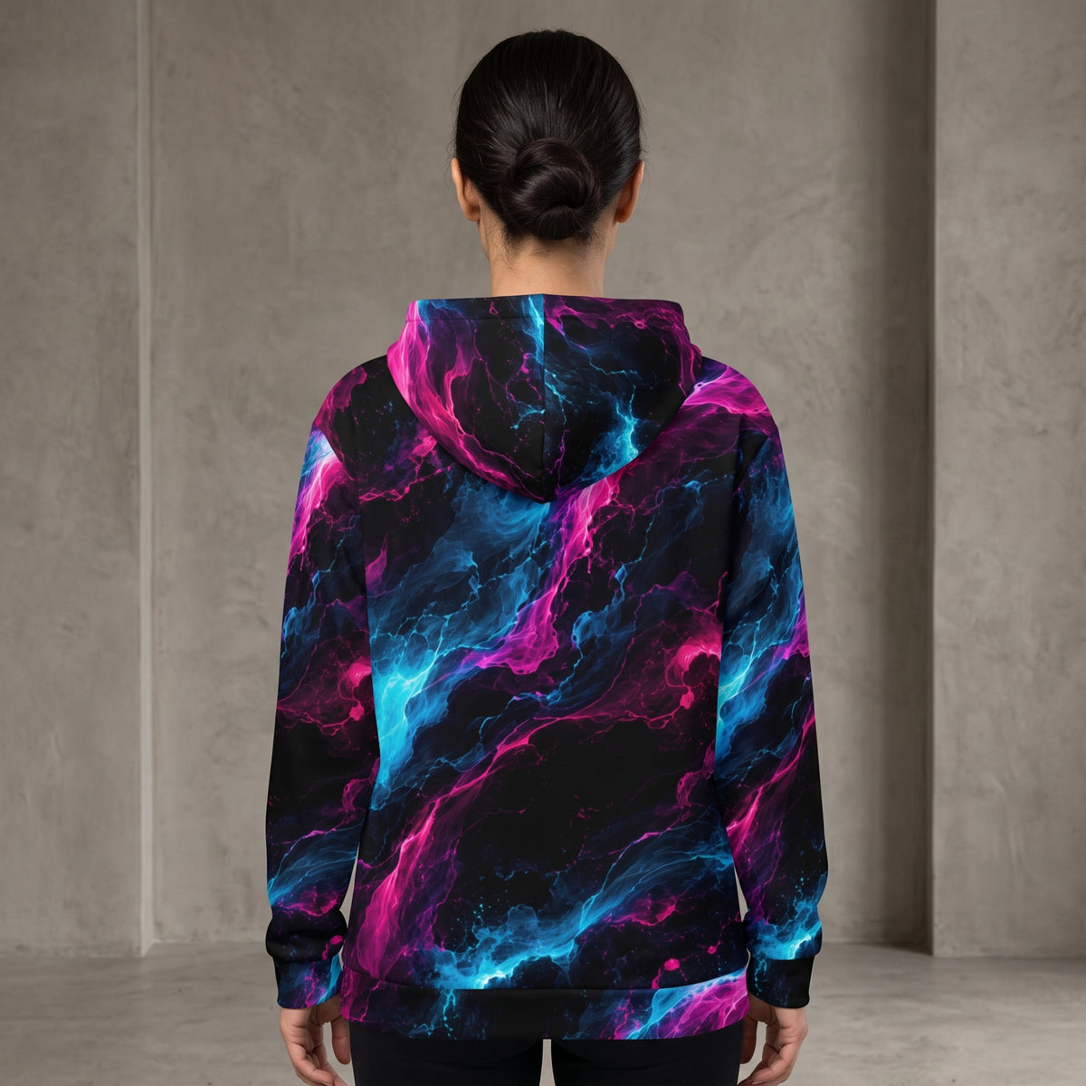 Woman wearing the Neon Vortex zip hoodie, cyan and magenta print