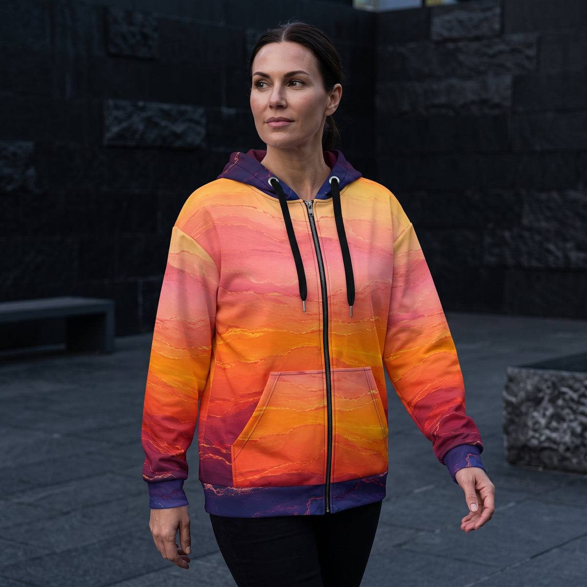 Woman walking in the Solar Horizon zip hoodie, sunset gradient print