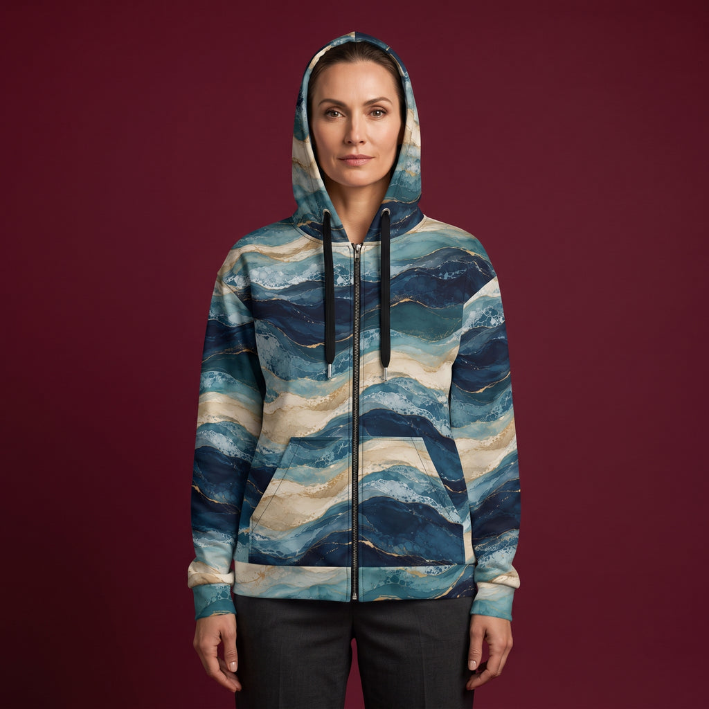 Woman wearing the Oceanic Strata zip hoodie zipped up, navy and teal print